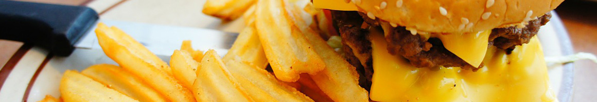 Eating Burger Cheesesteak at Jerry's Gourmet Burgers restaurant in Villa Rica, GA.